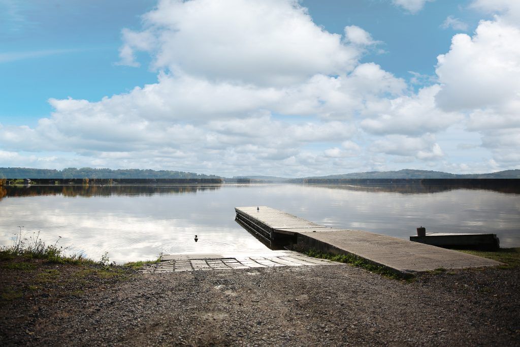 A dock poking out into Big Moose lake.