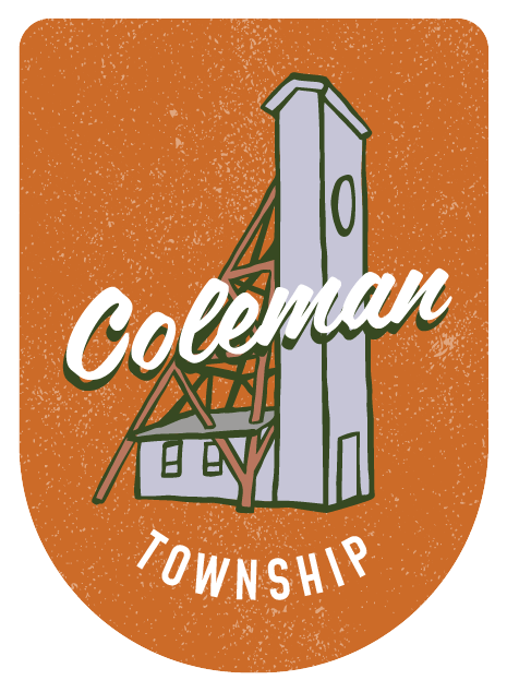 An illustrated badge featuring the mining headframe on an orange background.