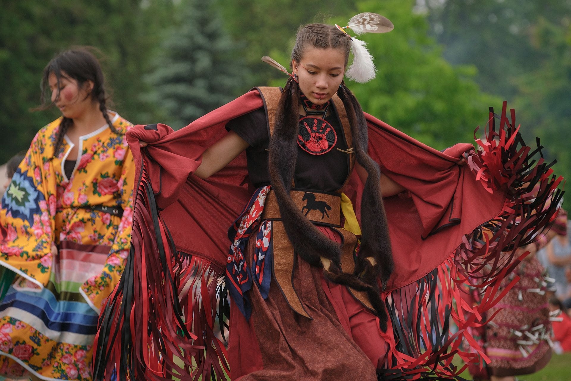 A young girl dances in regalia at a powwow in north Bay.