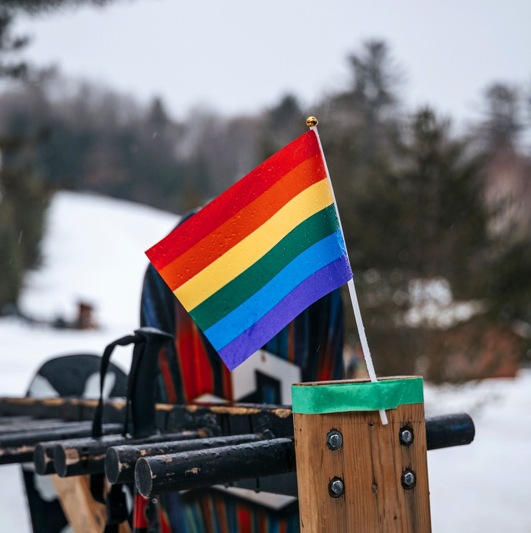 Pride flag affixed to a ski rack.