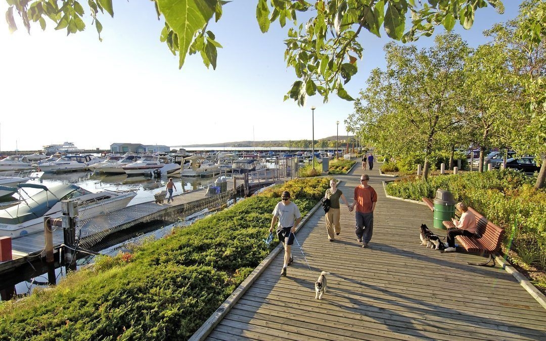 People walking along the waterfront in North Bay.