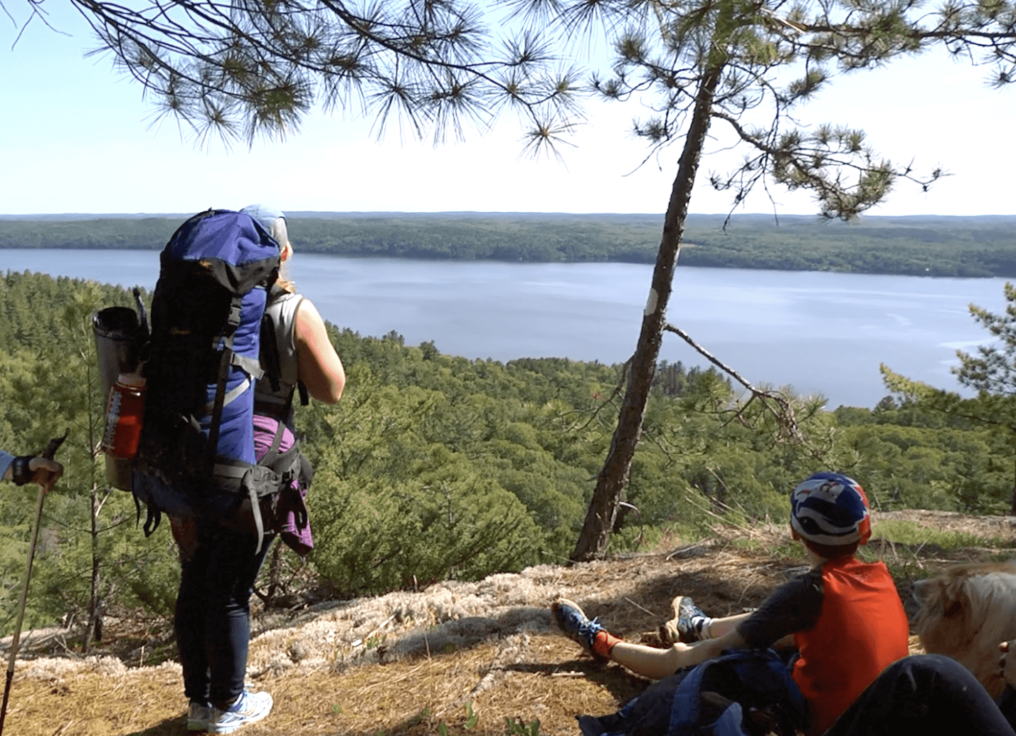 A mother and child look over a lake at the Nastawagan trails in Coleman Township.