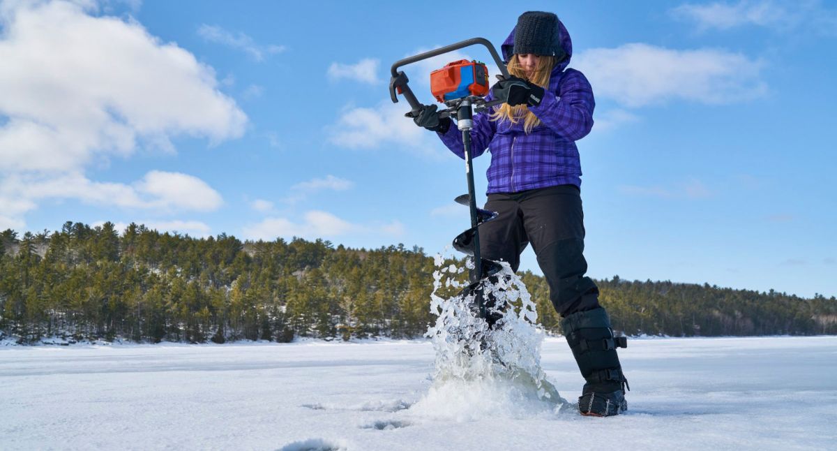 Ice Fishing Northeastern Ontario - Woman with Ice Auger